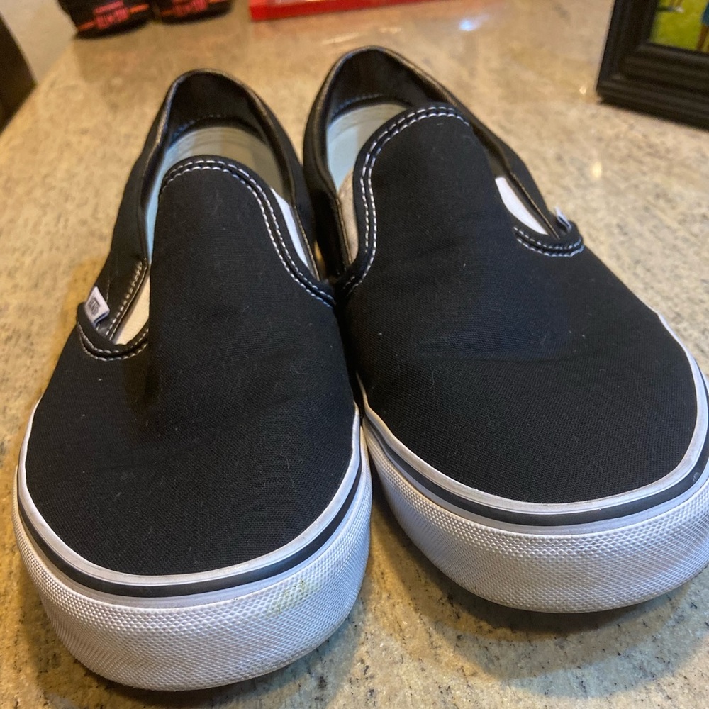 Black Vans Slip on’s. White sole. Mens size 12